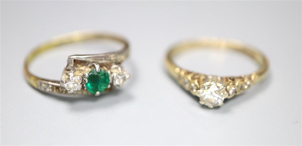 An 18ct and plat, emerald and diamond set three stone crossover ring, with diamond set shoulders and a 9ct & diamond ring.